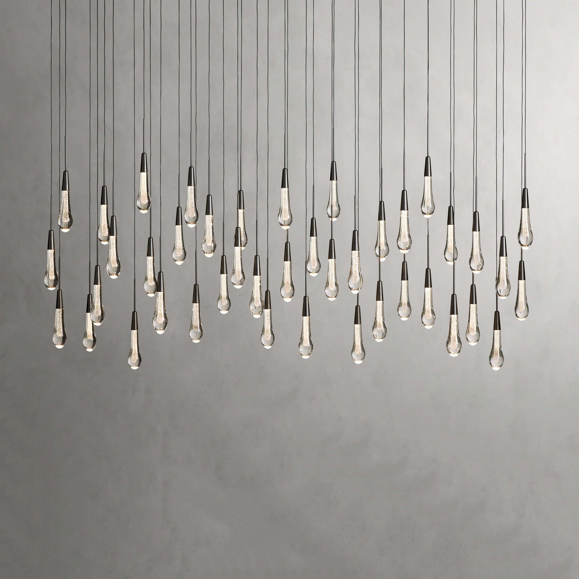 Denise Raindrop Glass Solitaire Linear Chandelier