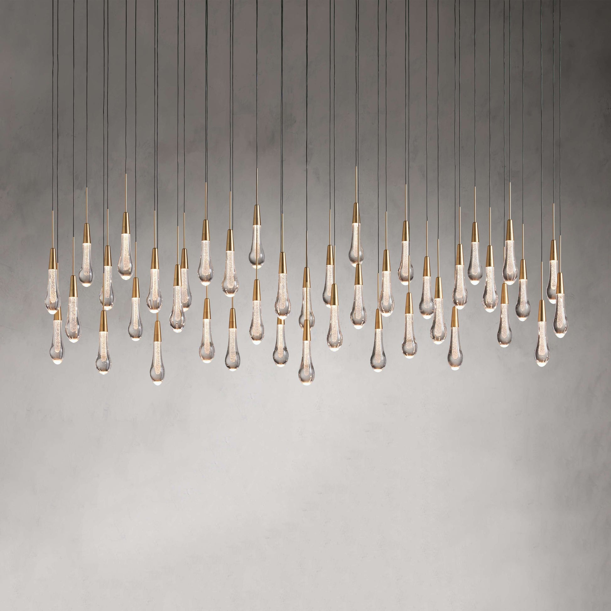 Denise Raindrop Glass Solitaire Linear Chandelier