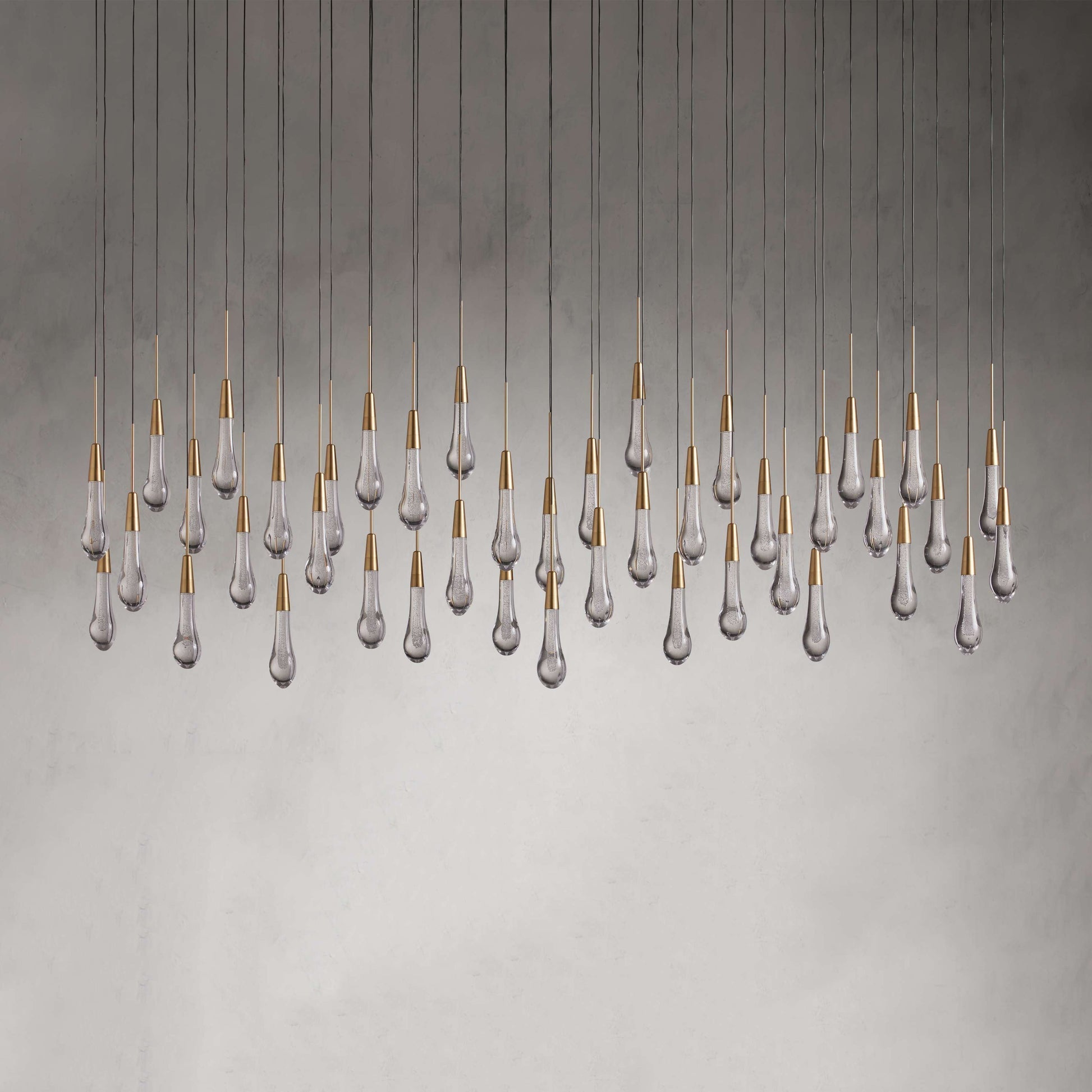 Denise Raindrop Glass Solitaire Linear Chandelier